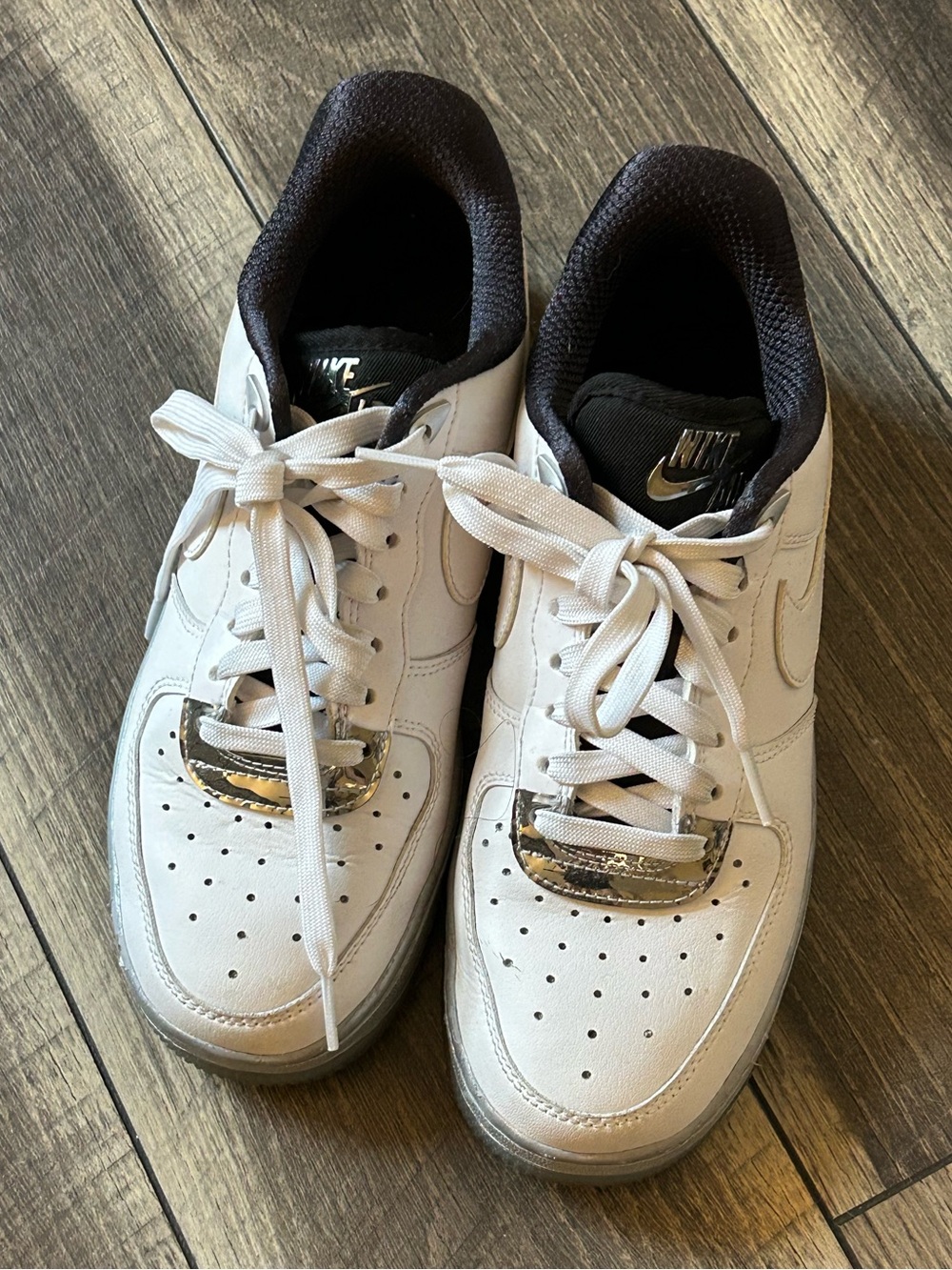 Nike Air Force 1 Metallic White Sneakers with Black Lining and Silver Accents